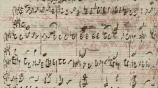 Historisch muziekmanuscript van de Matthäus Passion van Johann Sebastian Bach, met handgeschreven muzieknoten en partituren.